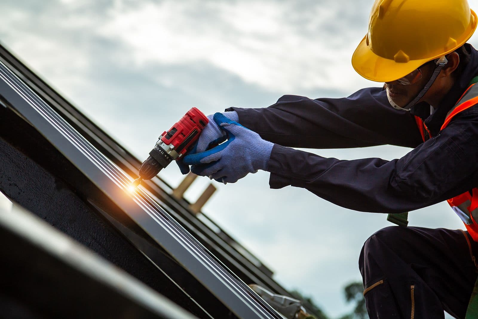 Roofer worker in protective uniform wear and gloves, Construction worker install new roof