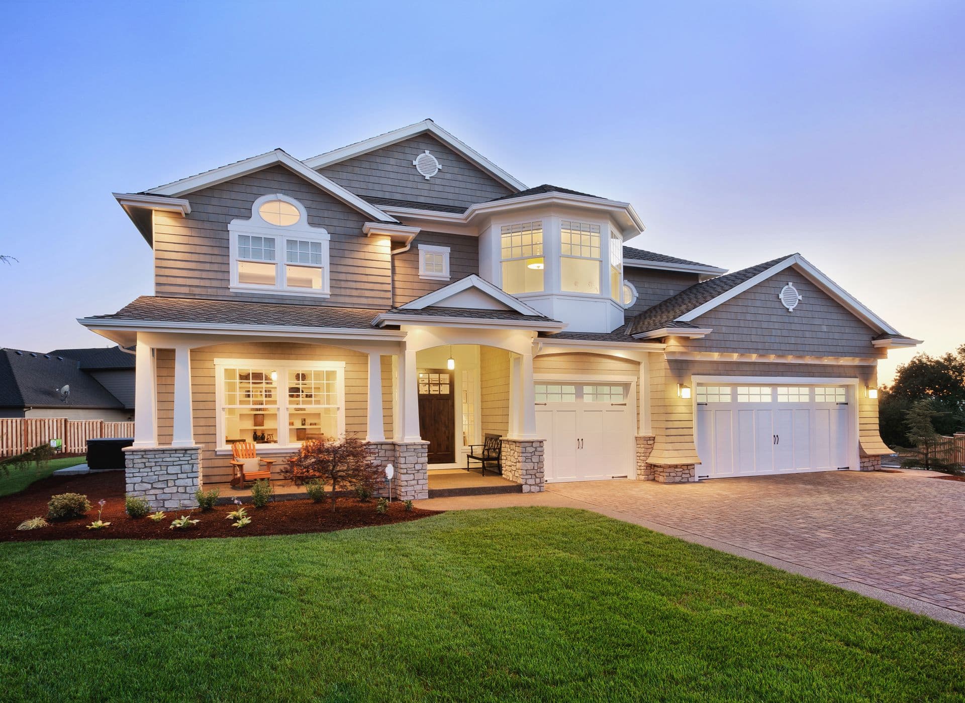 Beautiful exterior of modern new home at sunset