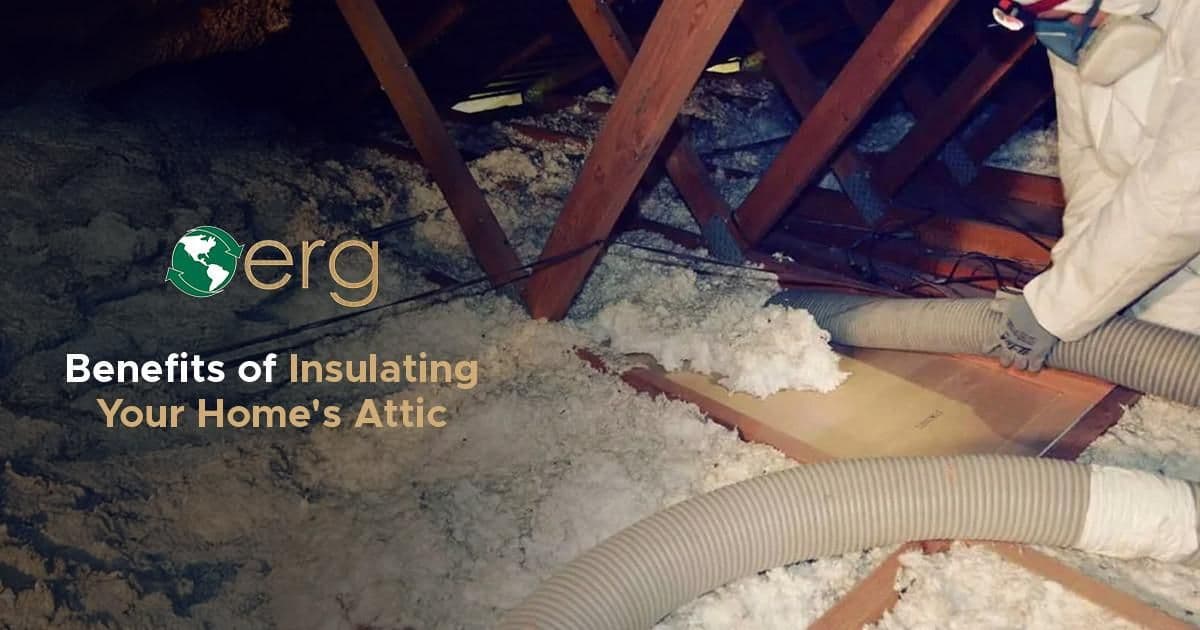 Promotional graphic featuring the ERG logo and text reading "Benefits of Insulating Your Home's Attic." The background shows a worker using a large vacuum tube to remove old loose-fill insulation from an attic space.