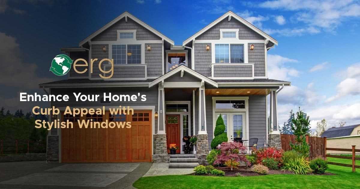 Promotional graphic featuring the ERG logo and text reading "Enhance Your Home's Curb Appeal with Stylish Windows." The background depicts a two-story Craftsman-style home with gray siding, white trim, stone accents, and a landscaped lawn under a bright blue sky.